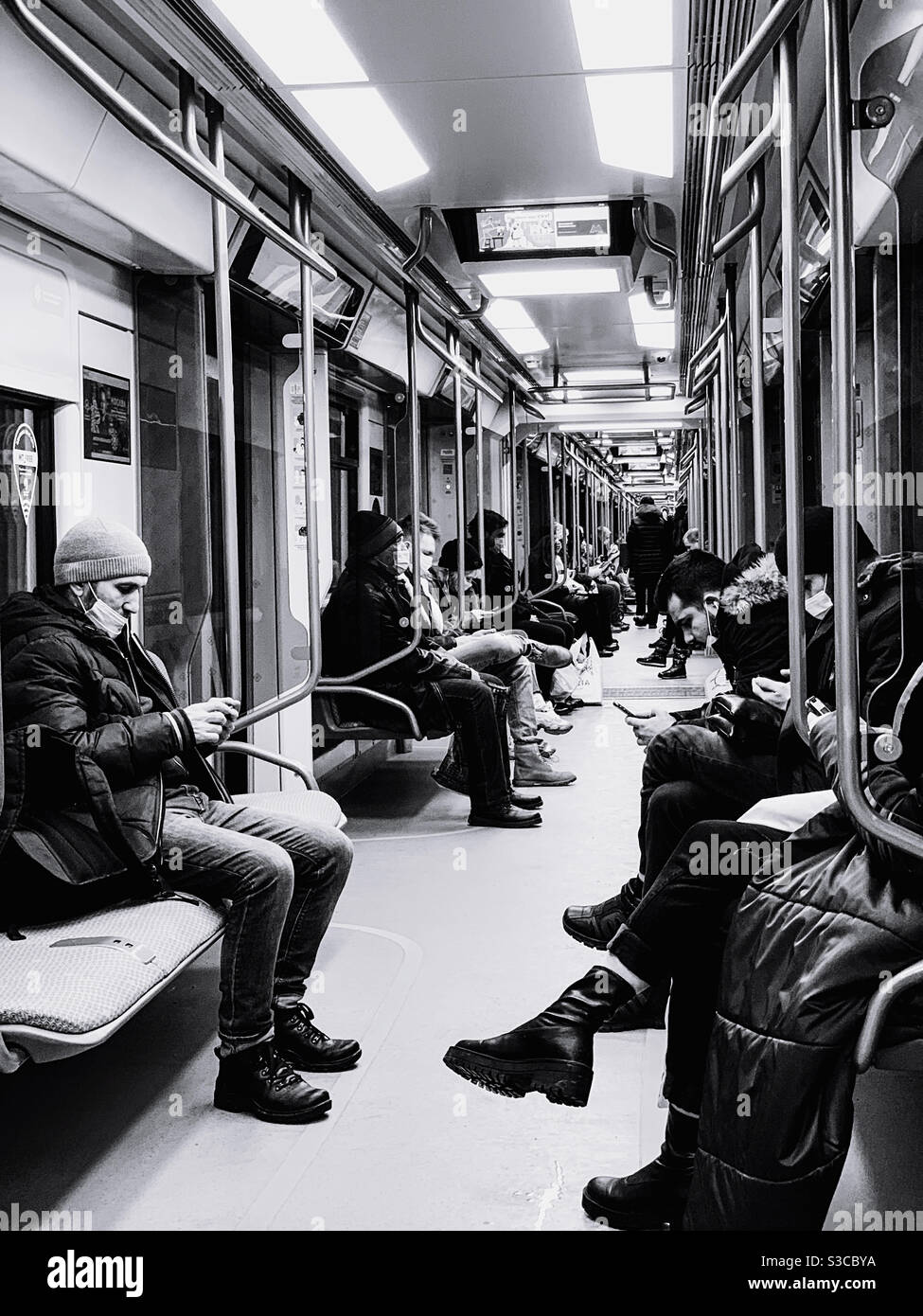 Passengers traveling in subway cars - Smartphone Captured Stock Image