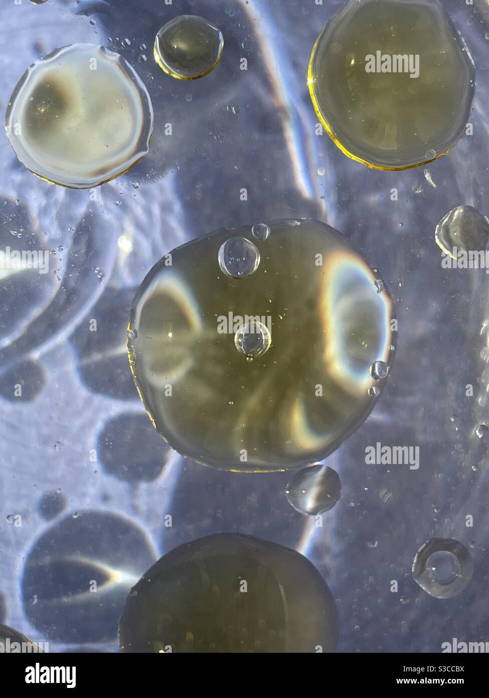 Abstract oil and water bubbles on blue background - Smartphone Captured Stock Image Abstract oil and water bubbles on blue background - Smartphone Captured Stock Image