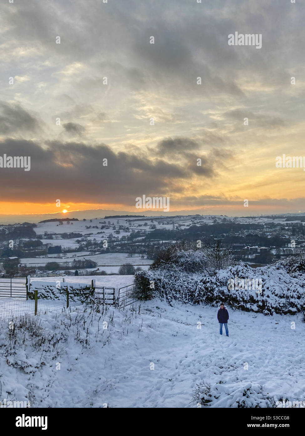 Lockdown sunset over Ilkley Moor while walking in the snow Guisley West Yorkshire - Smartphone Captured Stock Image