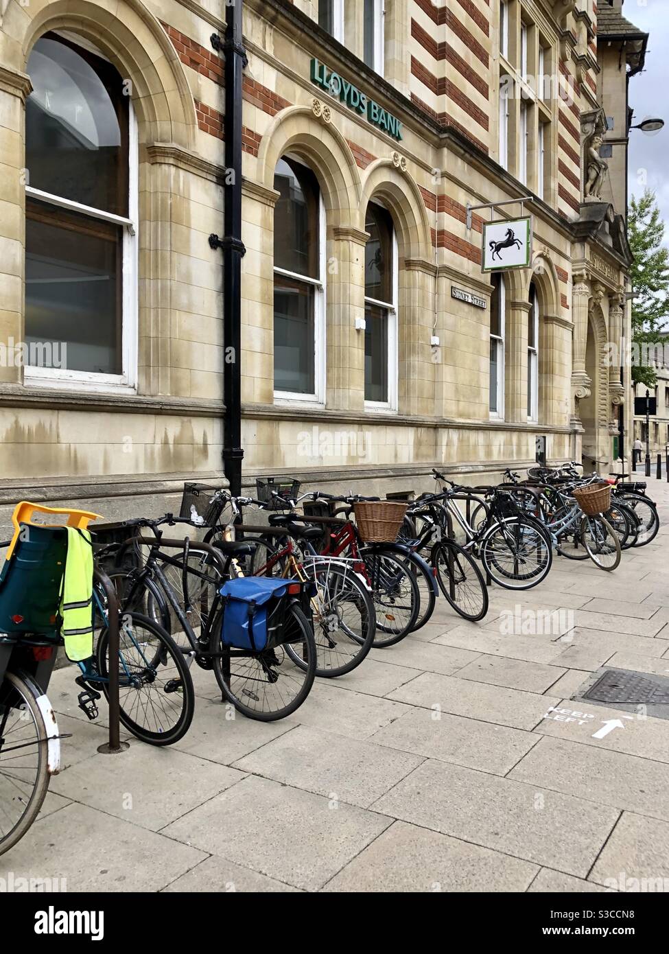 Row of bikes in Cambridge outside a branch of Lloyd’s bank - Smartphone Captured Stock Image
