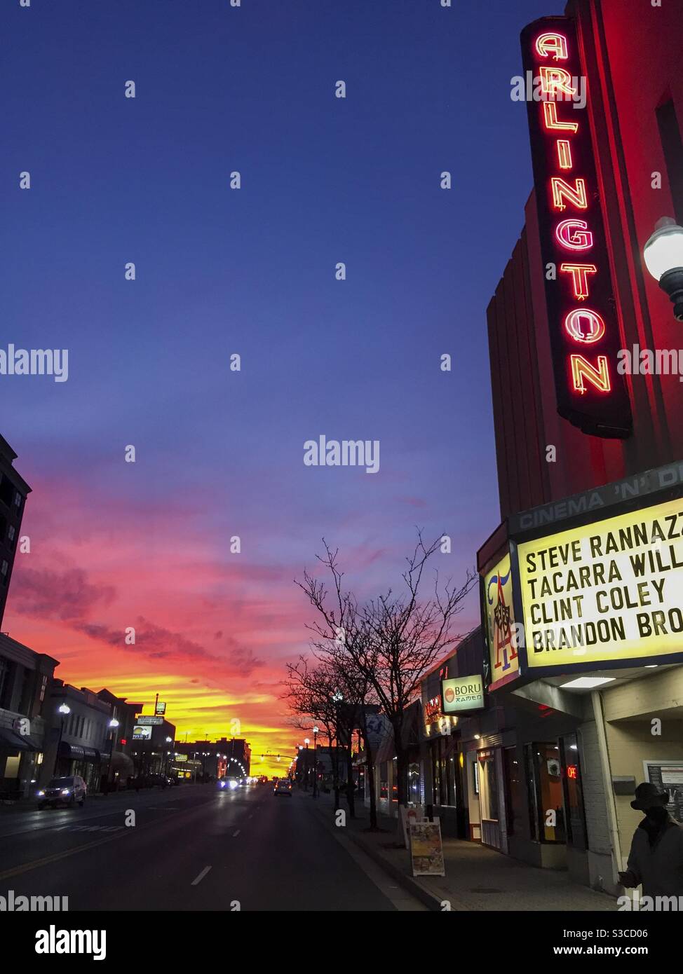 The sun sets on the neon sign at Arlington Cinema and Drafthouse on Columbia Pike in Arlington, Virginia. Stock Photo