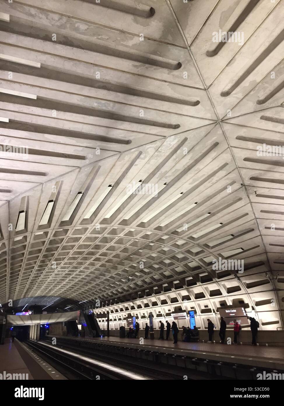 Interior view of Metro station in Washington DC. Commuters wait for subway train to arrive. - Smartphone Captured Stock Image