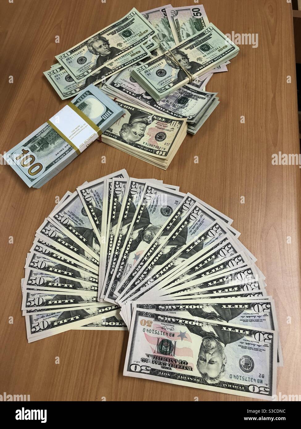US American dollars on the table in different denomination. Stock Photo