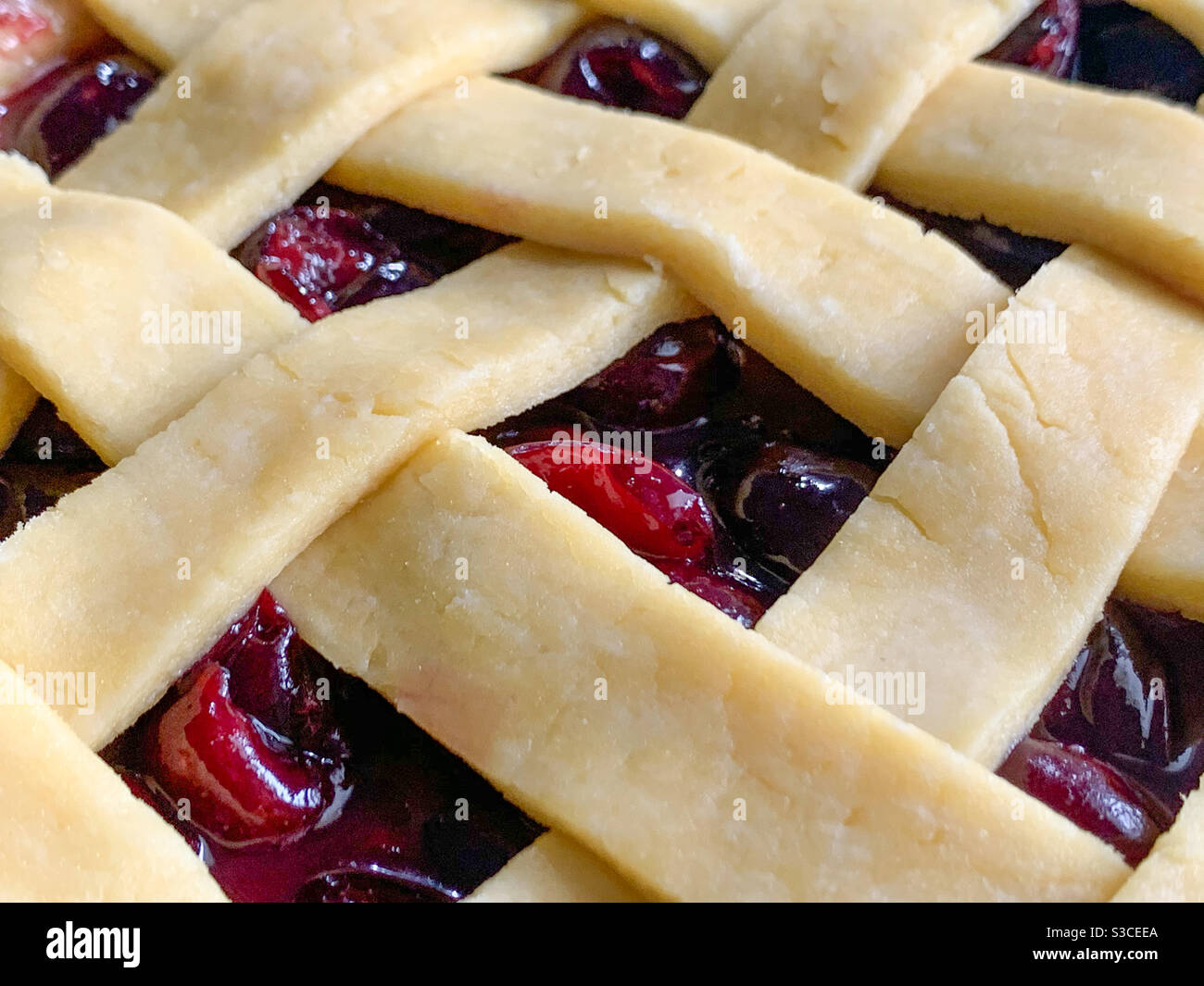 Lattice pattern pastry on Cherry pie uncooked - Smartphone Captured Stock Image