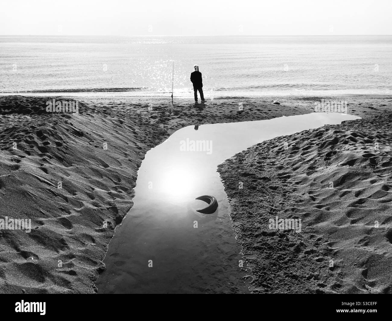 Man standing by the shore - Smartphone Captured Stock Image
