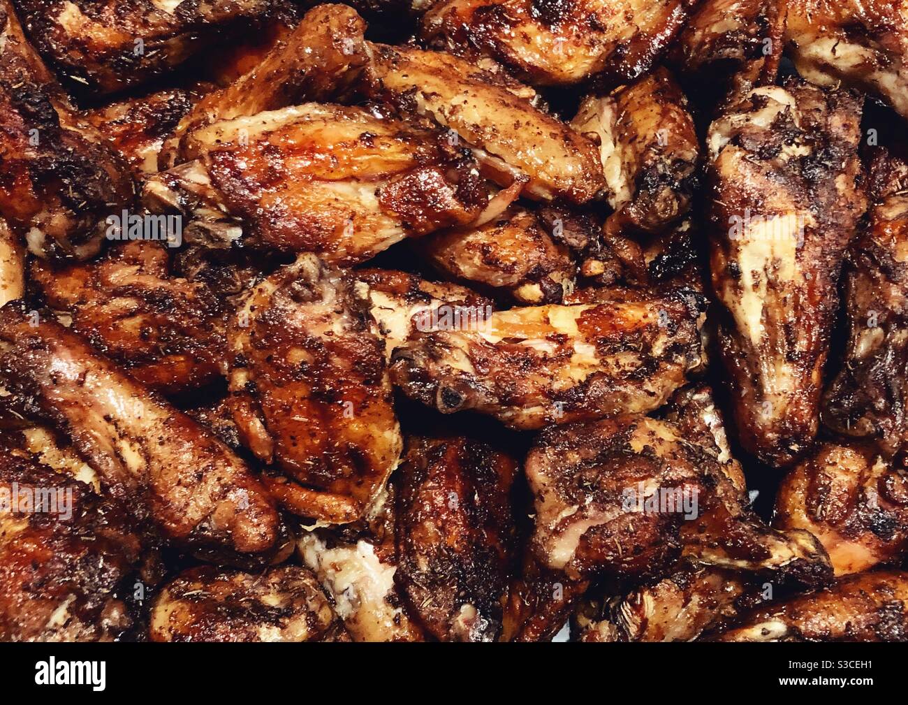 Closeup of cooked crispy chicken wings made with homemade rub Stock Photo