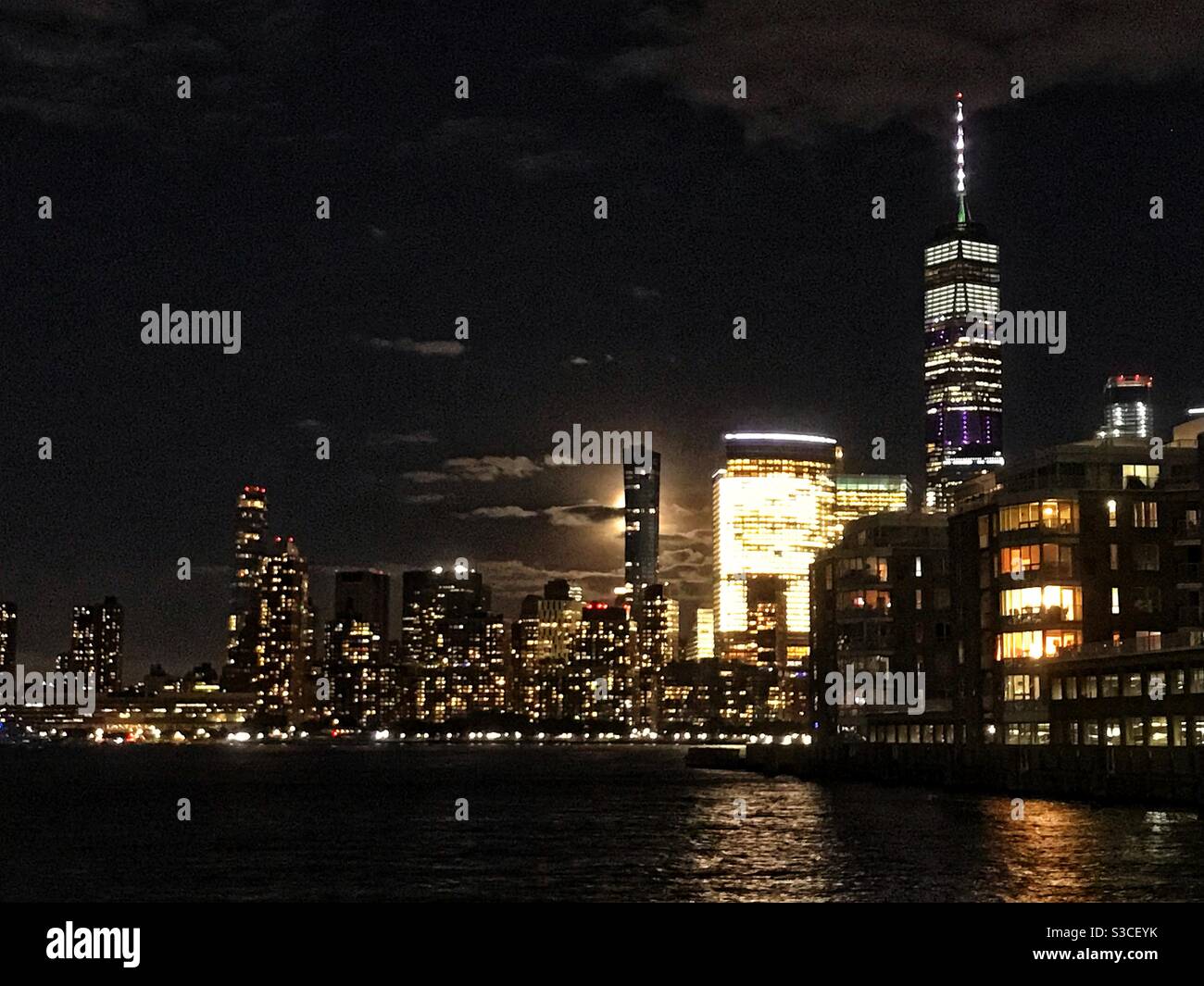 Lower Manhattan at night as seen from Jersey City waterfront Stock Photo