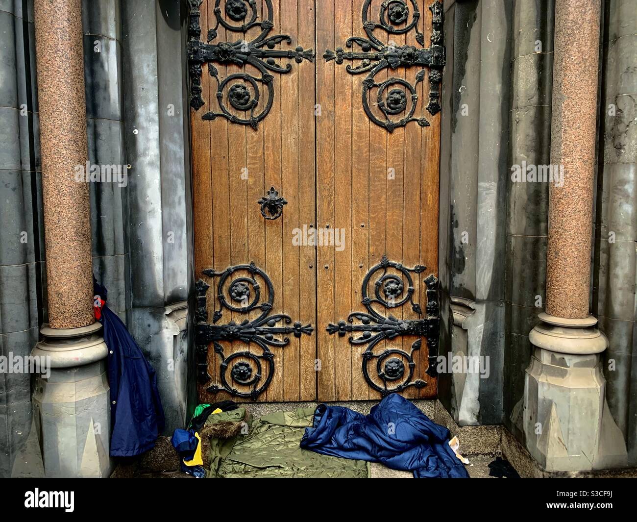 A homeless sleeping spot in the doorway of a church in Dublin. - Smartphone Captured Stock Image