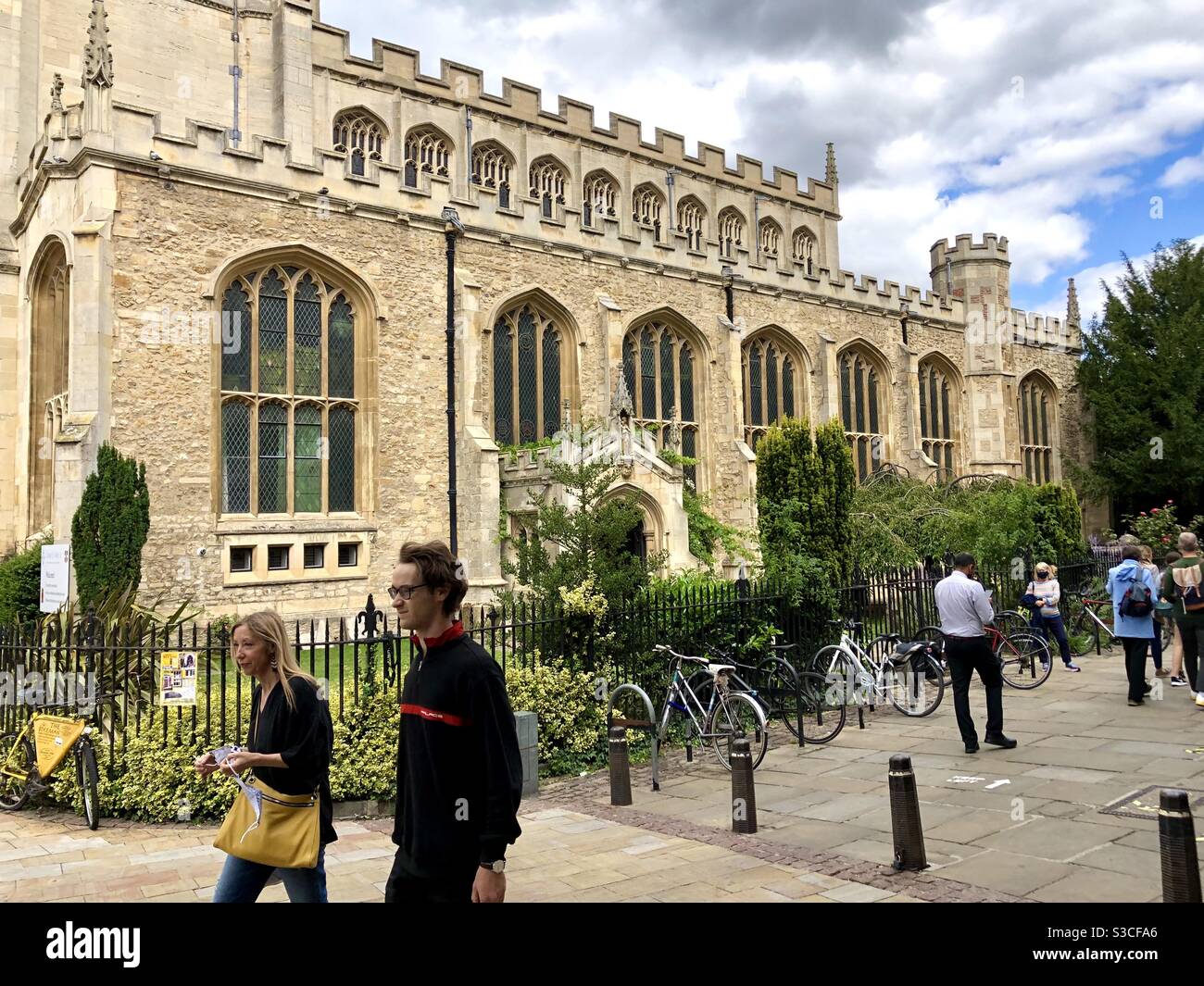 Tourists walking past Great St Mary’s church in Cambridge Stock Photo
