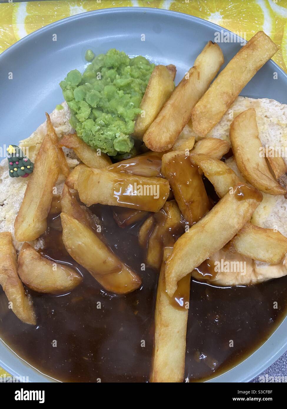 Barm Cake, Chips, Gravy and Mushy Peas and English Food delacy Stock