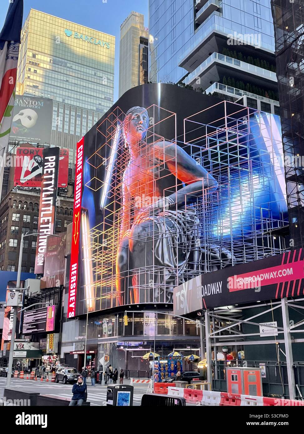 Where does the virtual reality end and our reality begin? This giant dazzling neon sign reflects the chaotic crosshatching - Smartphone Captured Stock Image