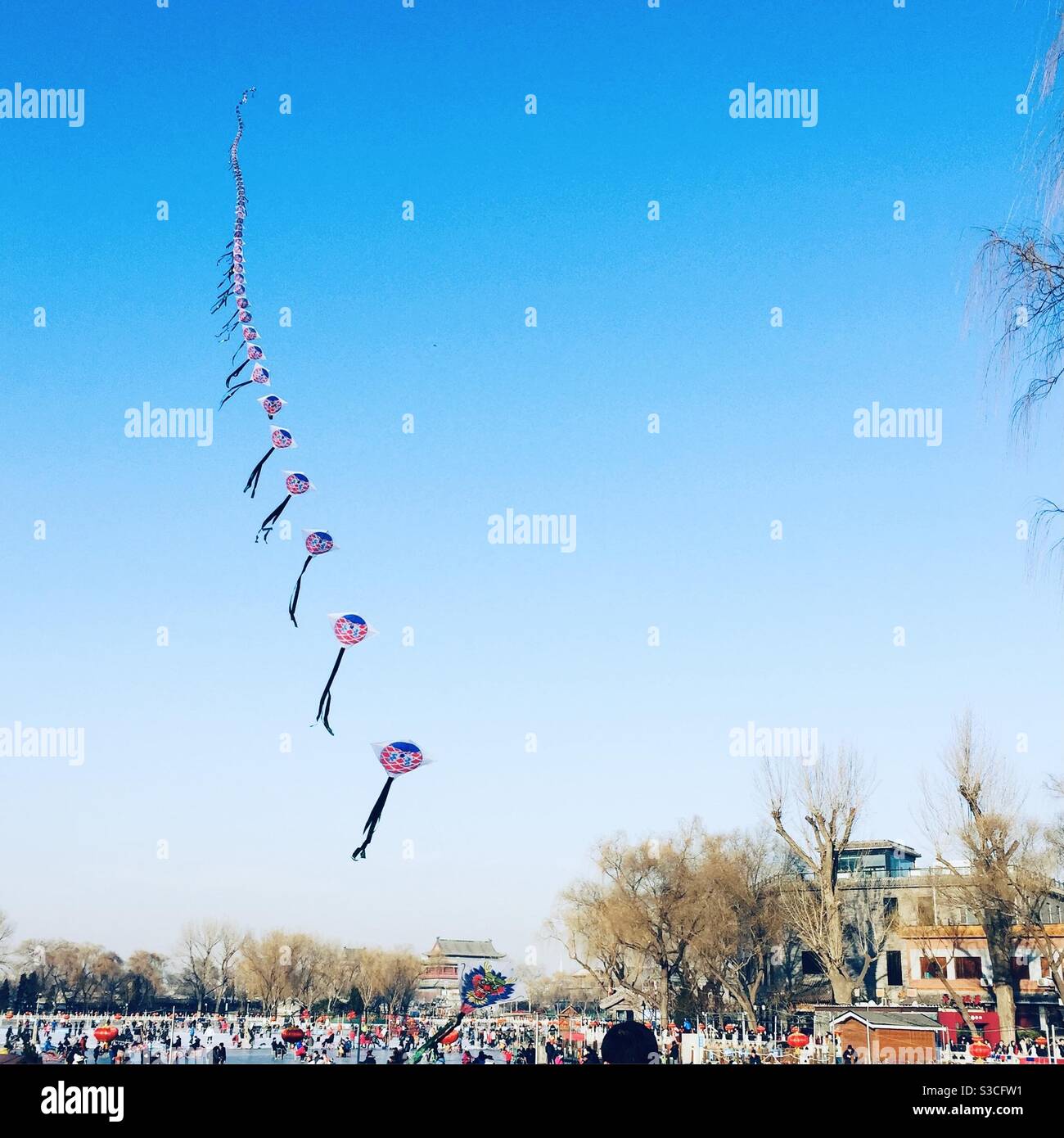 Kite flying Beijing China on a winters day - Smartphone Captured Stock Image