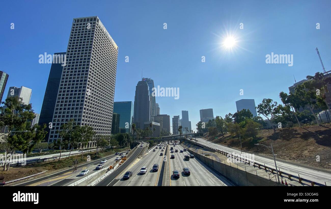 LOS ANGELES, CA, SEP 2020: Downtown city skyline with skyscrapers and tall buildings, seen across the CA-110 freeway and off ramps - Smartphone Captured Stock Image