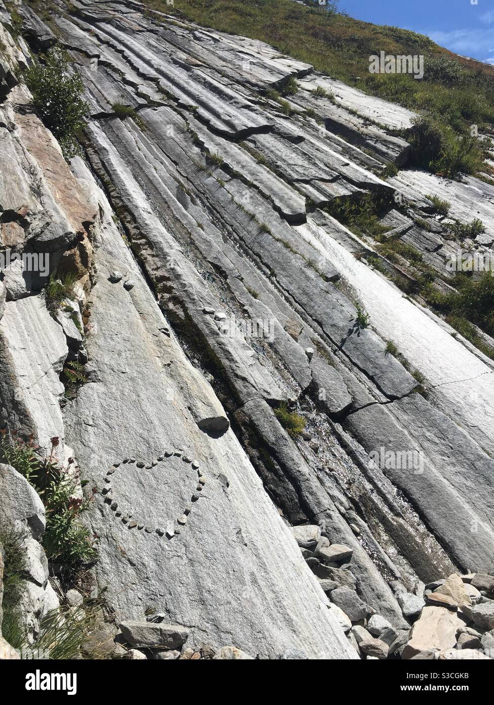 Heart built by peoples on glacier ground rock, Saas valley, Valais, Switzerland Stock Photo