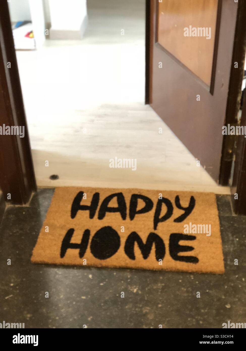 Happy home door mat Stock Photo