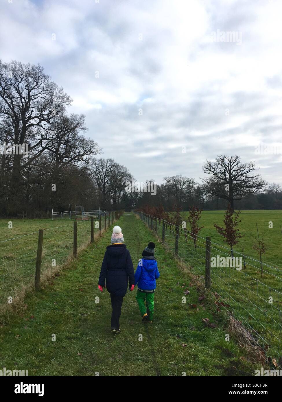 Children on winter walk in field - Smartphone Captured Stock Image