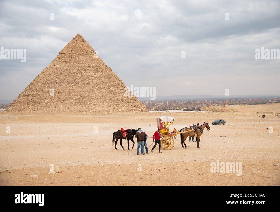 One pyramid of Egypt and workers with horses during winter - Smartphone Captured Stock Image