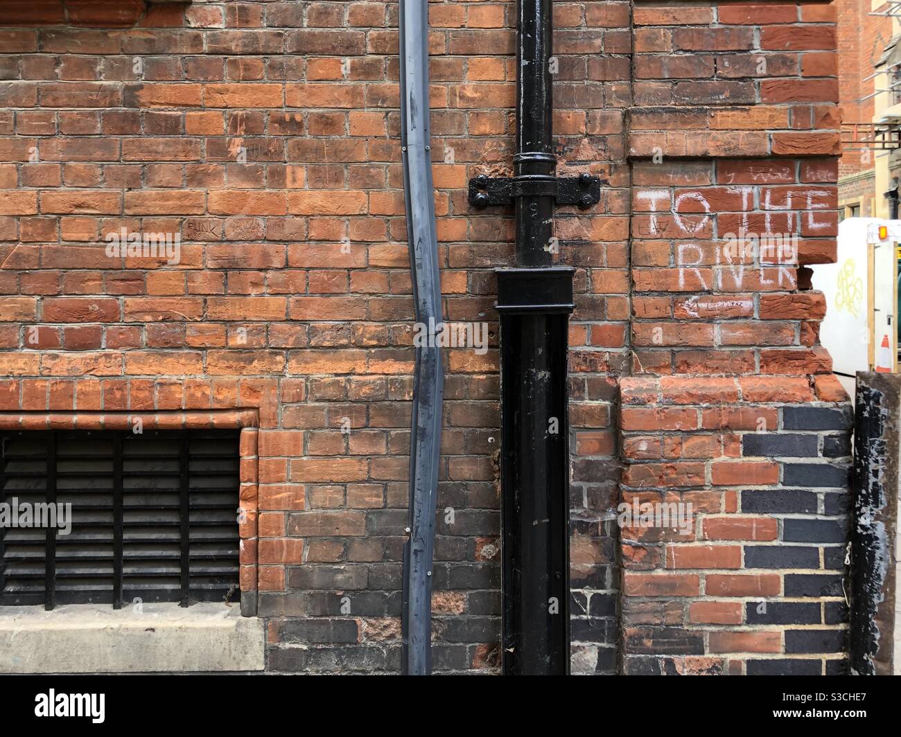 To the river written in white chalk or paint on a wall in Cambridge - Smartphone Captured Stock Image