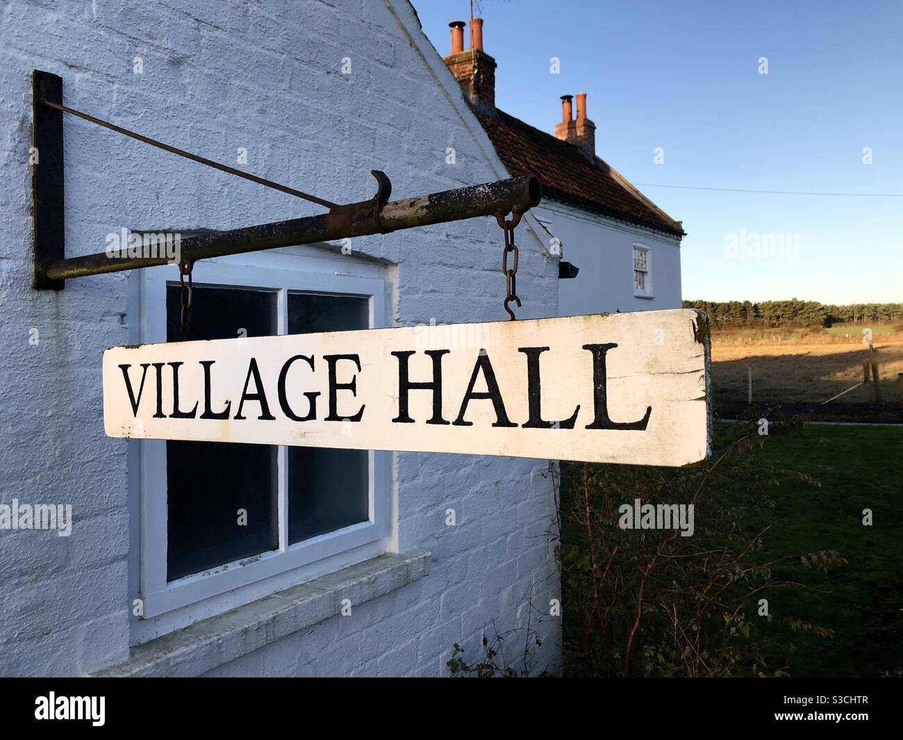 A local village hall sign in a small countryside community Stock Photo