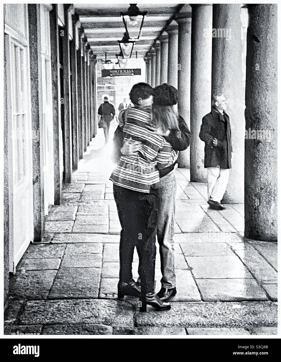 A couple sharing a kiss in North Row, Covent Garden London. - Smartphone Captured Stock Image