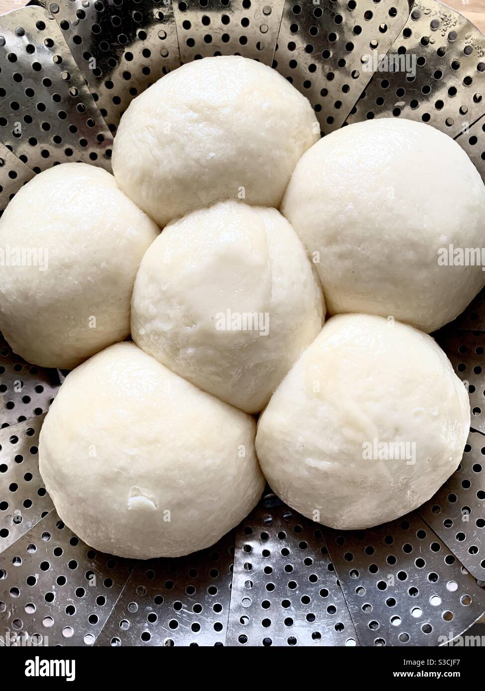 Side dish dumplings made of yeast dough and cooked in vapour. Stock Photo