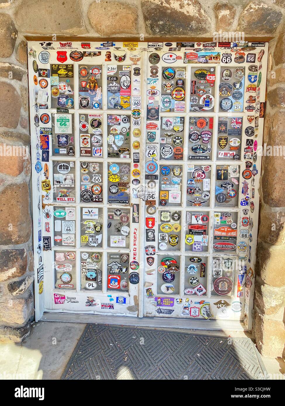Tons of stickers on a door Stock Photo