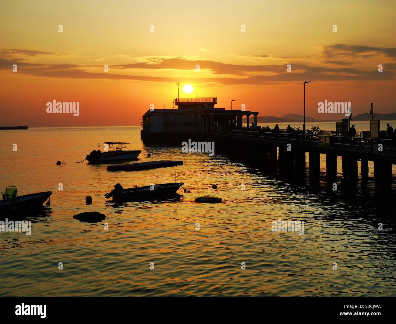 A beautiful sunset seen from Lamma island in Hong Kong. - Smartphone Captured Stock Image