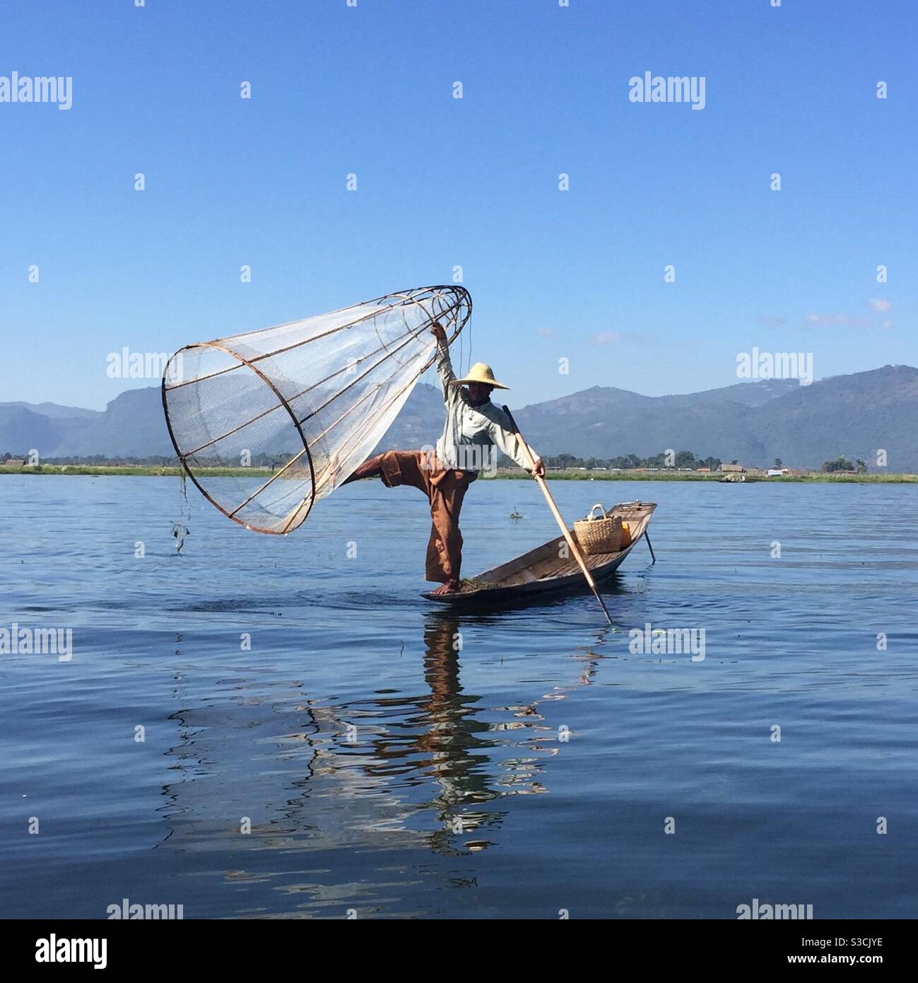 Fishing with net on Inle Lake Myanmar - Smartphone Captured Stock Image