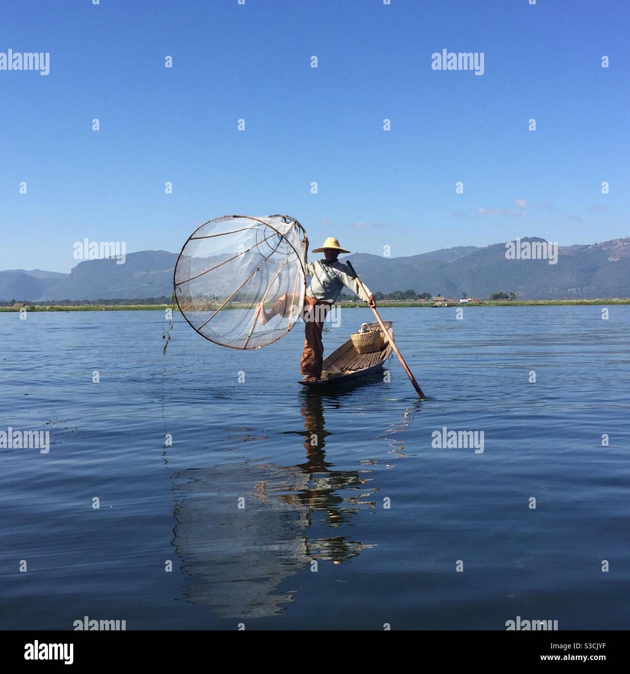 Fisherman leg rowing on Inle Lake Myanmar - Smartphone Captured Stock Image