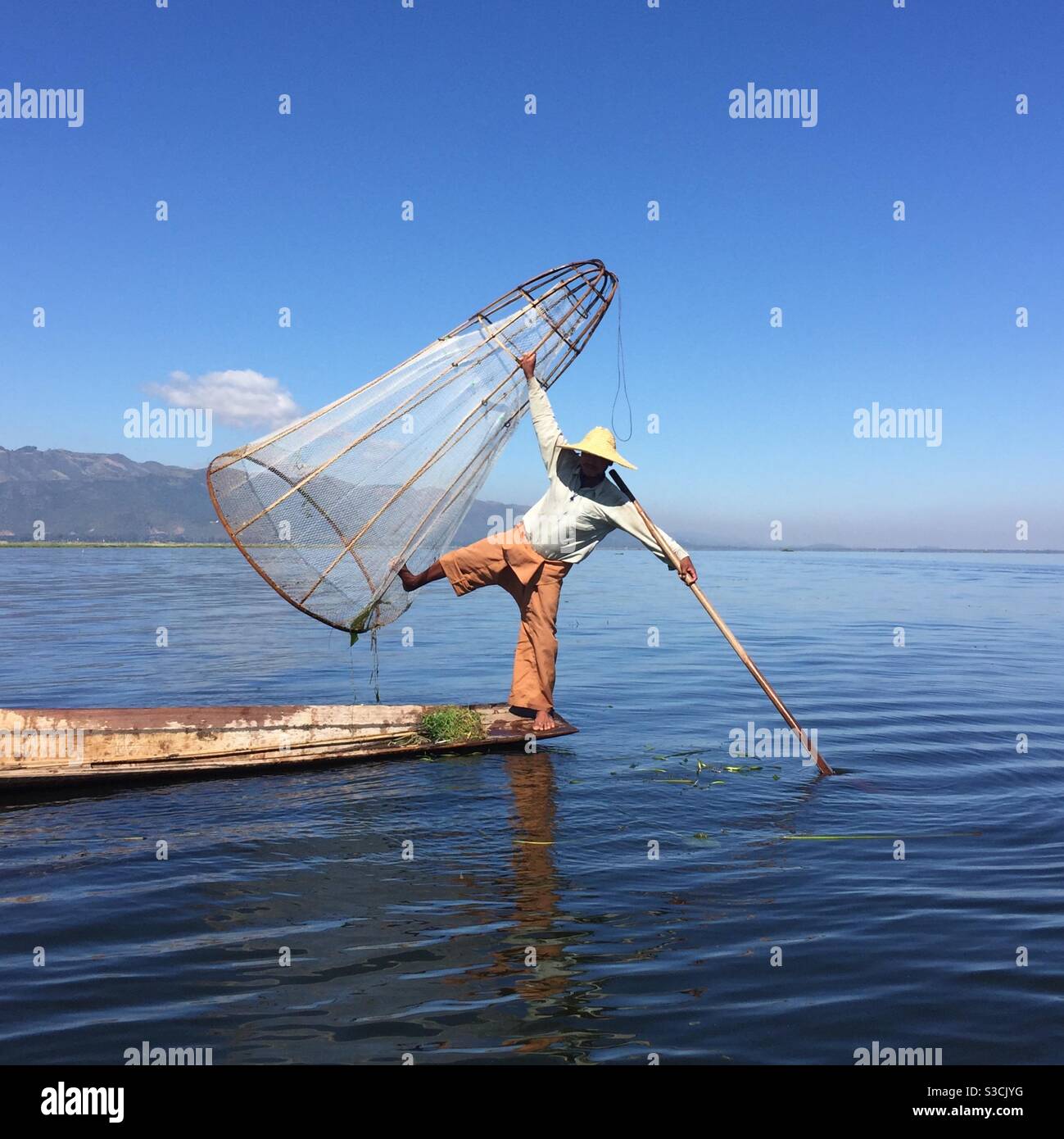 Leg rowing fisherman on Inle Lake Myanmar - Smartphone Captured Stock Image