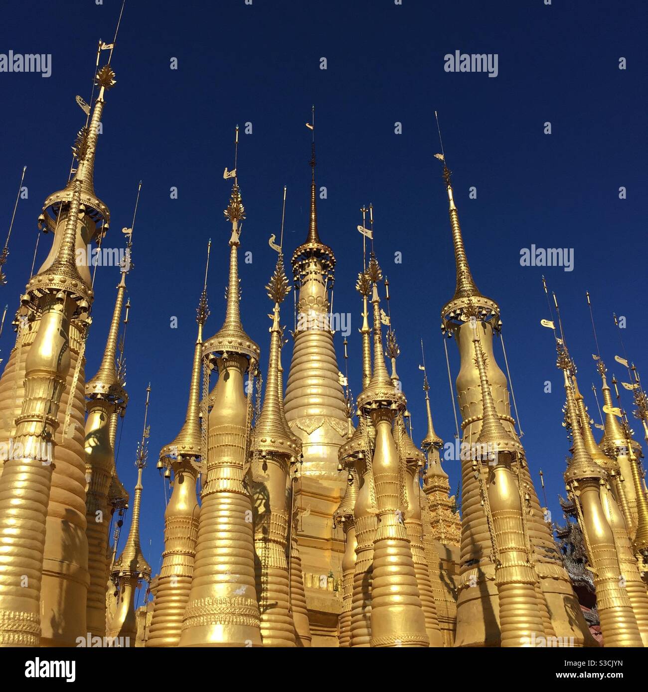 Gold stupas at Phaung Daw U Pagoda Inle Lake Myanmar - Smartphone Captured Stock Image