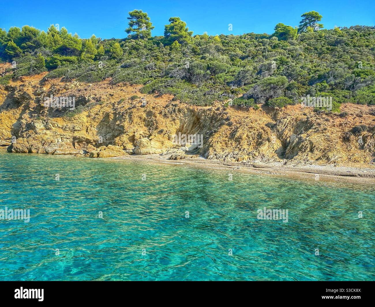 Turquoise waters at Arkos island near Skiathos, Greece. - Smartphone Captured Stock Image