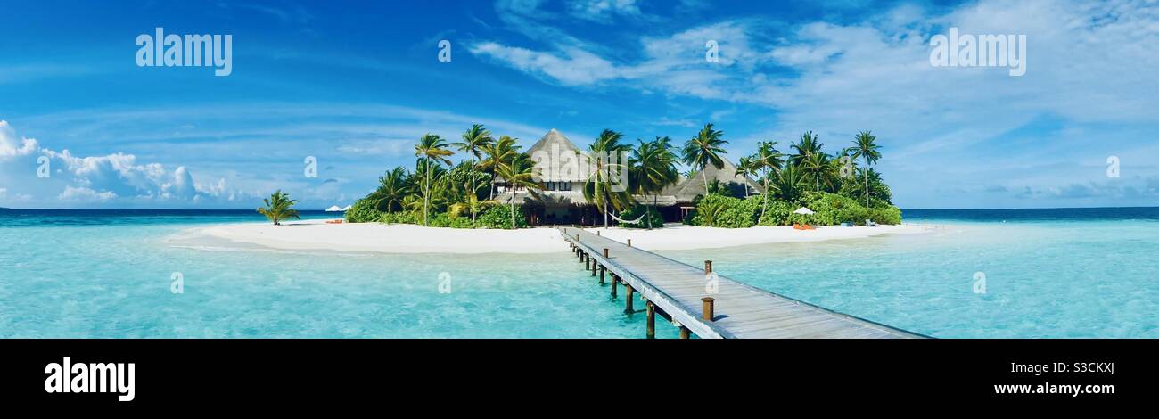 Mirihi island resort in the Maldives looking down the jetty to the island Stock Photo