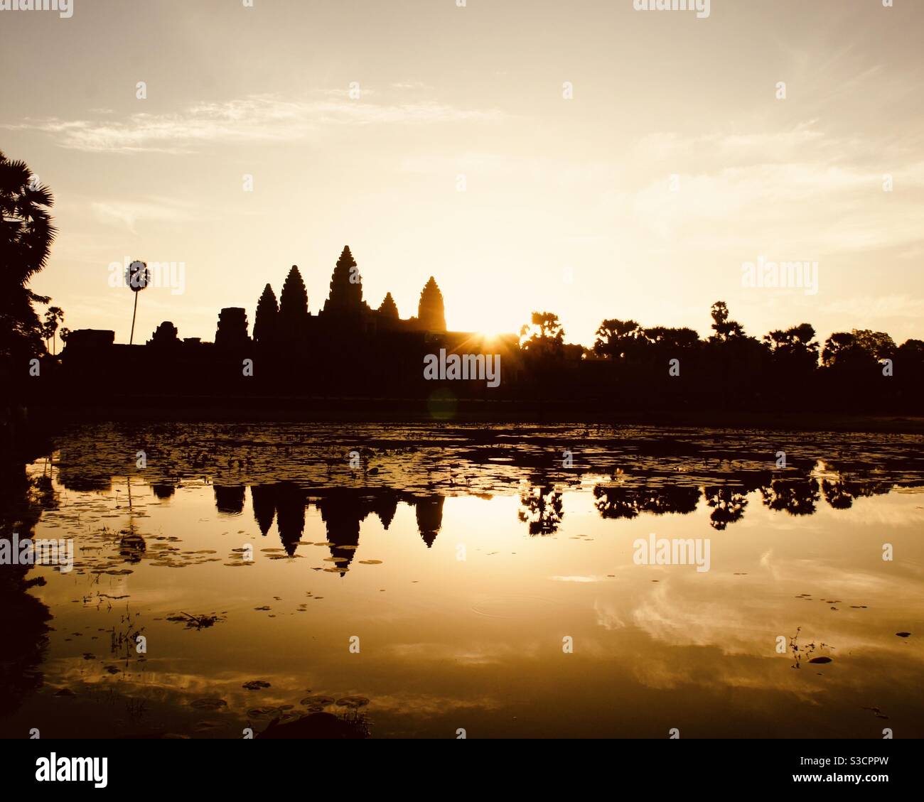 Angkor Wat at Sunrise reflecting in the lake Siem Reap Cambodia Stock Photo