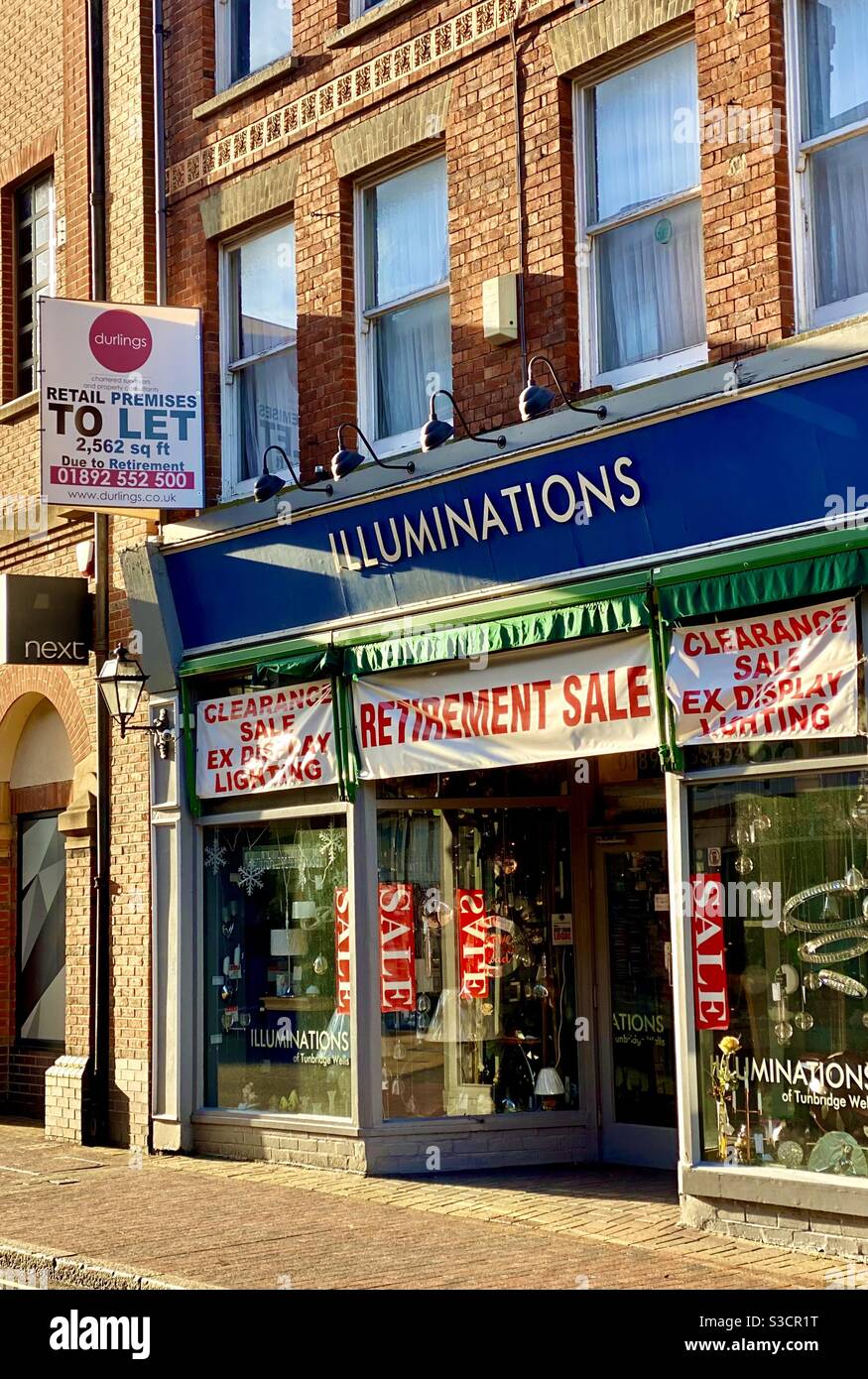 Retirement Sale TunbridgeWells. Also shows a letting Board for Stock Photo Alamy