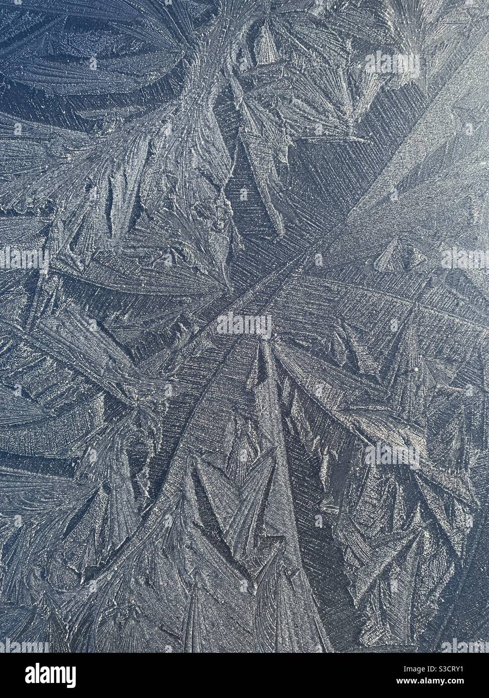 Abstract frost pattern on car bonnet Stock Photo
