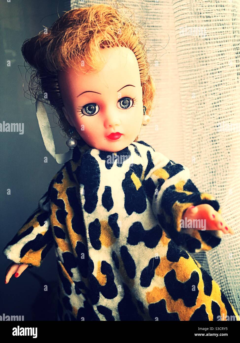 Antique 1950s vogue Jill doll in a dressy leopard coat, USA - Smartphone Captured Stock Image