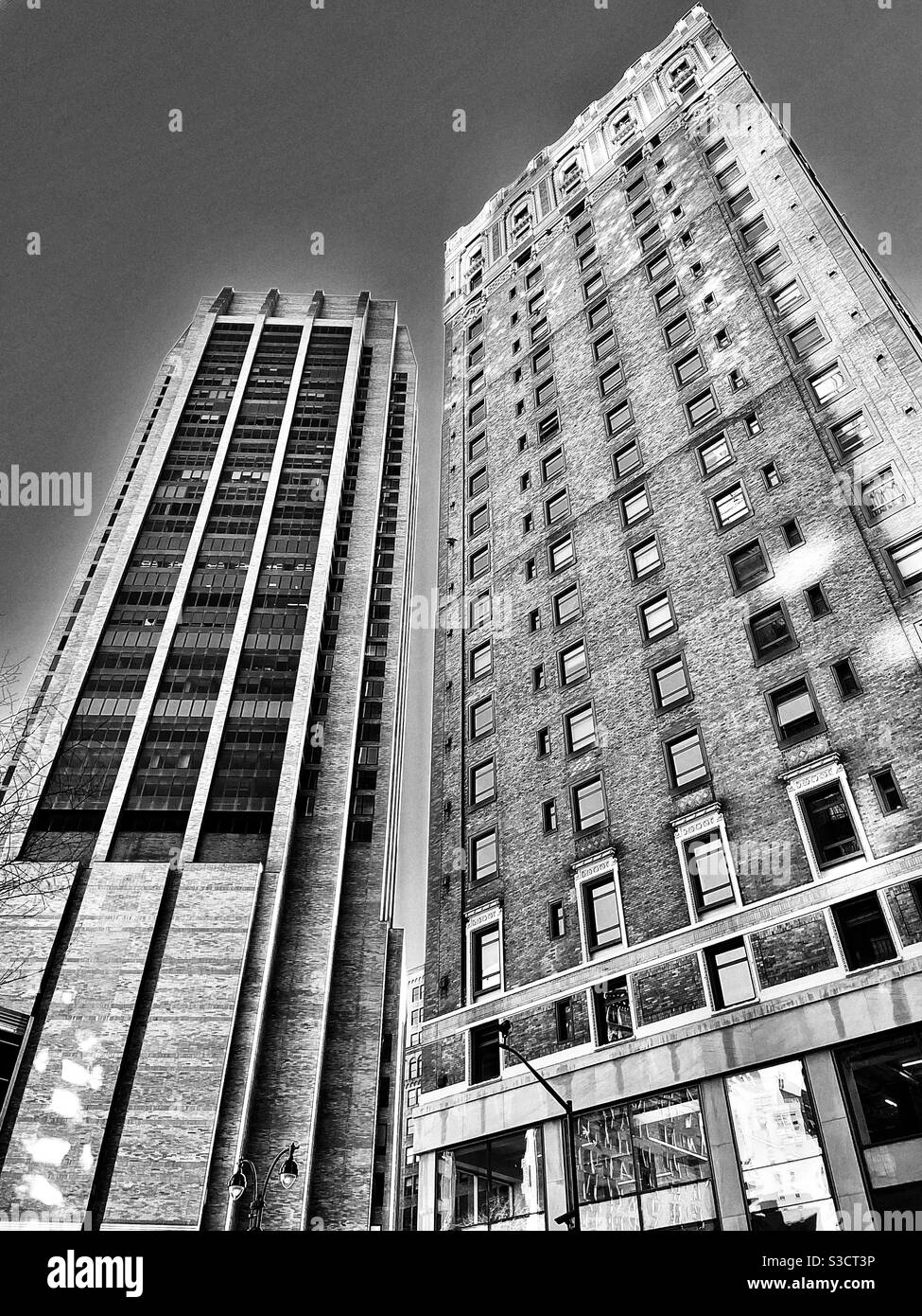 Sun-dappled Skyscrapers loom over the intersection of Park Avenue and 34th St. in New York City, USA - Smartphone Captured Stock Image