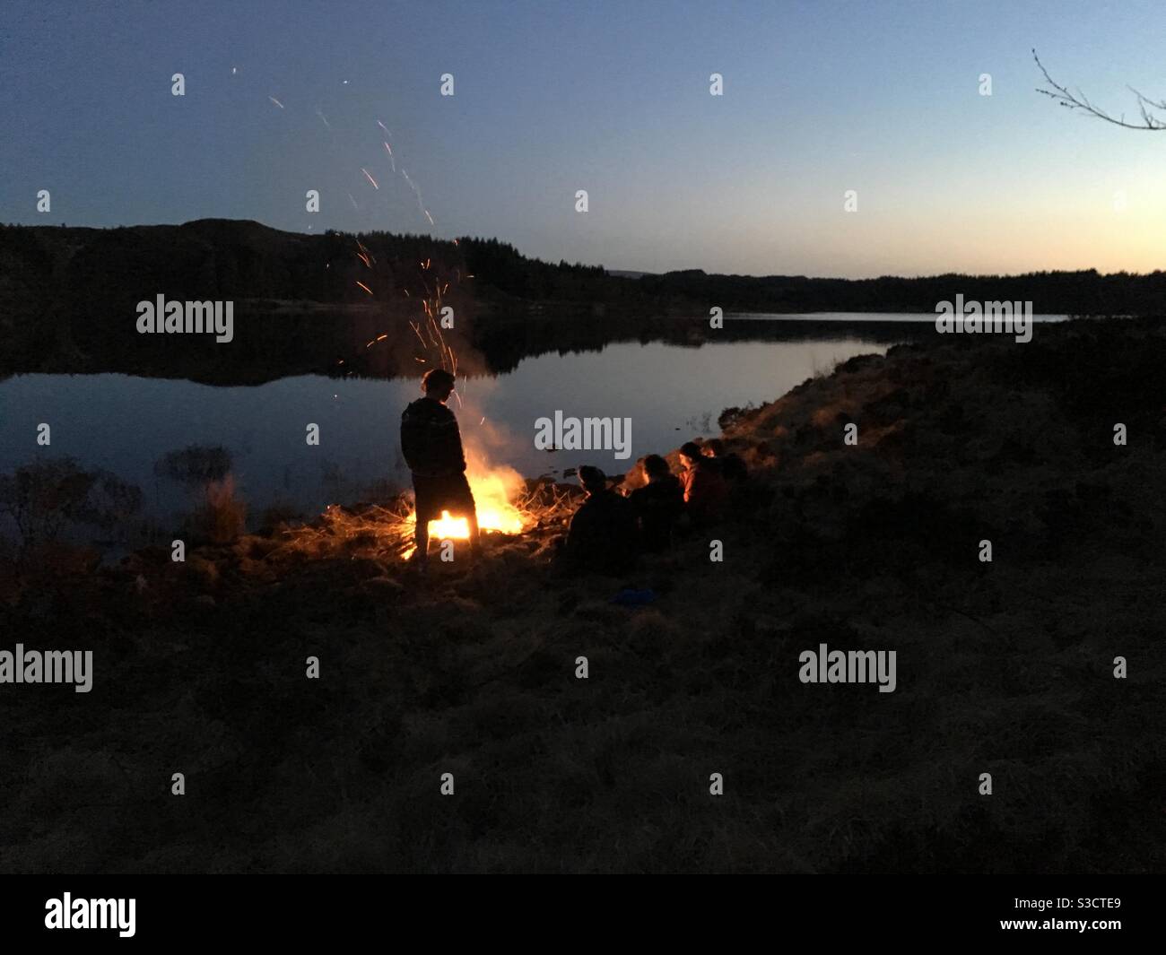 Campfire at dusk Stock Photo