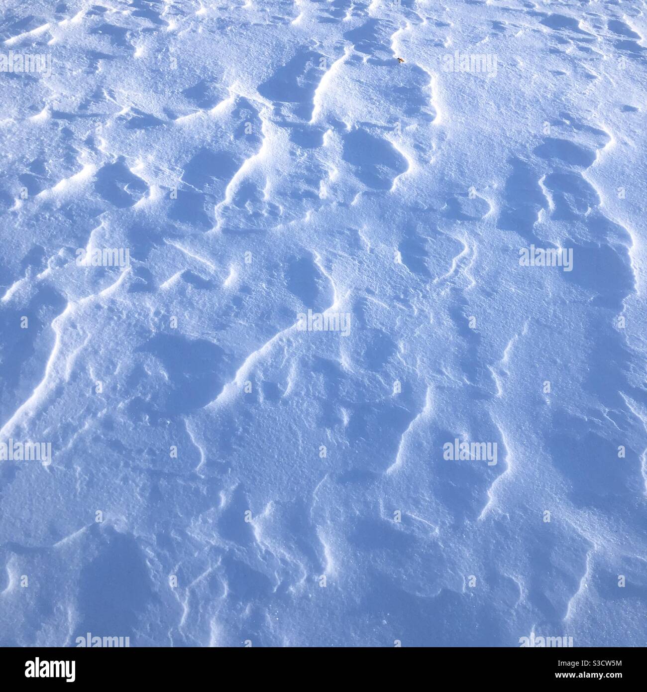 Close up view of the snow - texture, shades, pattern - Smartphone Captured Stock Image