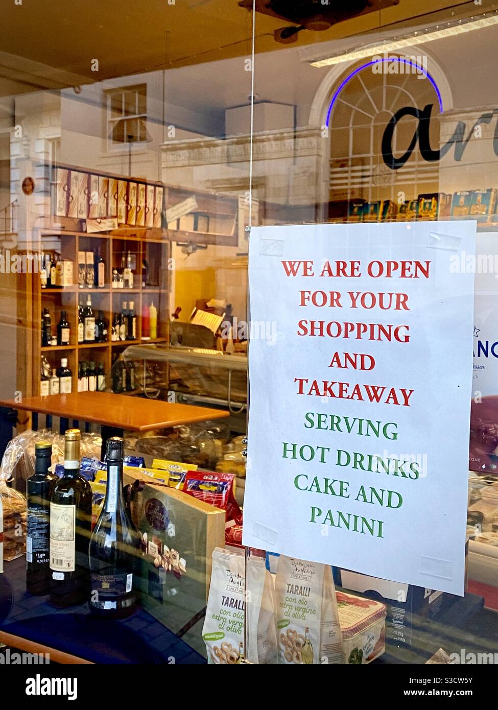 Italian takeaway shop with window notice during a virus pandemic lockdown period Stock Photo