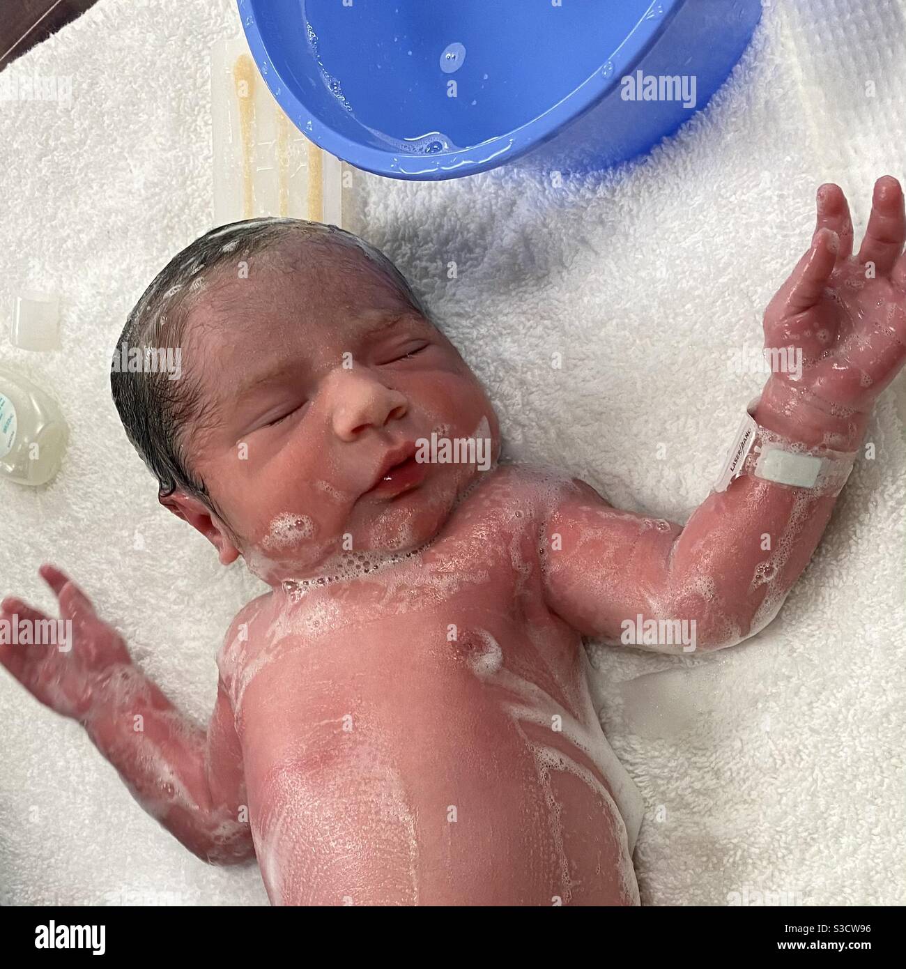Newborn Baby’s First Bath Stock Photo