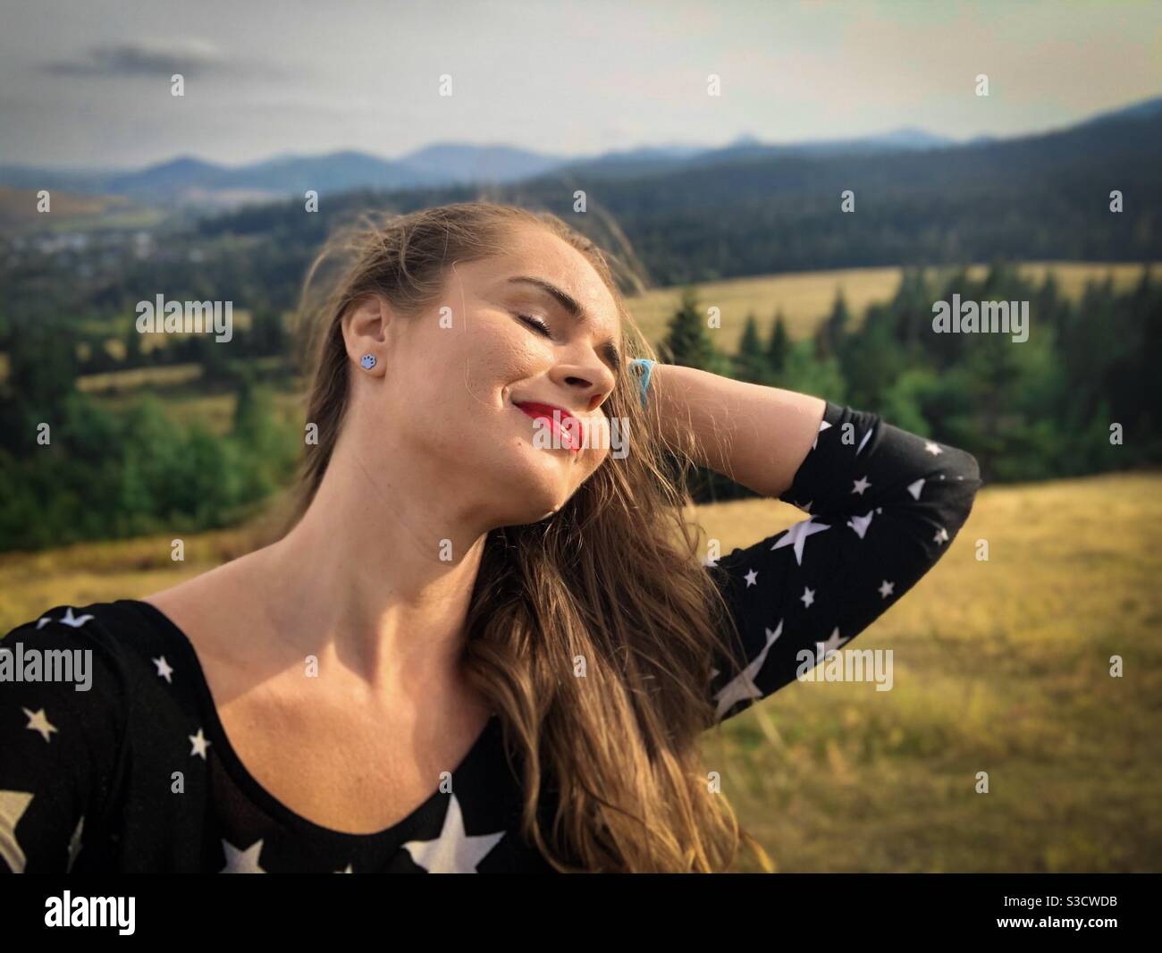 Portrait of young woman in the mountains - Smartphone Captured Stock Image