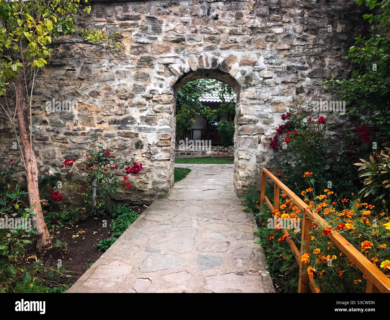 Garden with flowers and a wall made of bricks - Smartphone Captured Stock Image