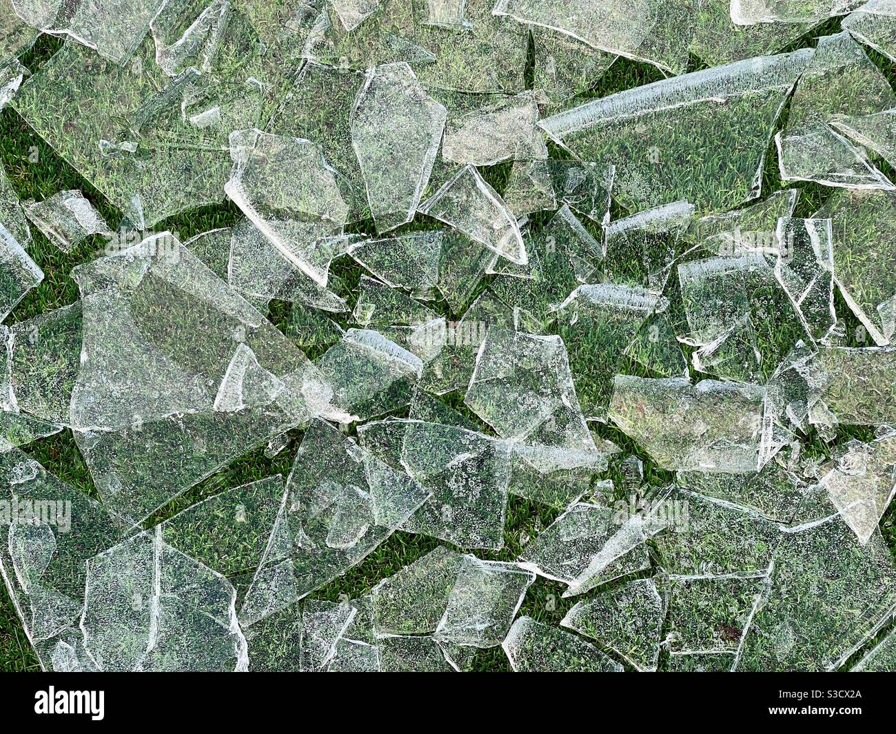 Broken ice on a lawn. No people. Stock Photo