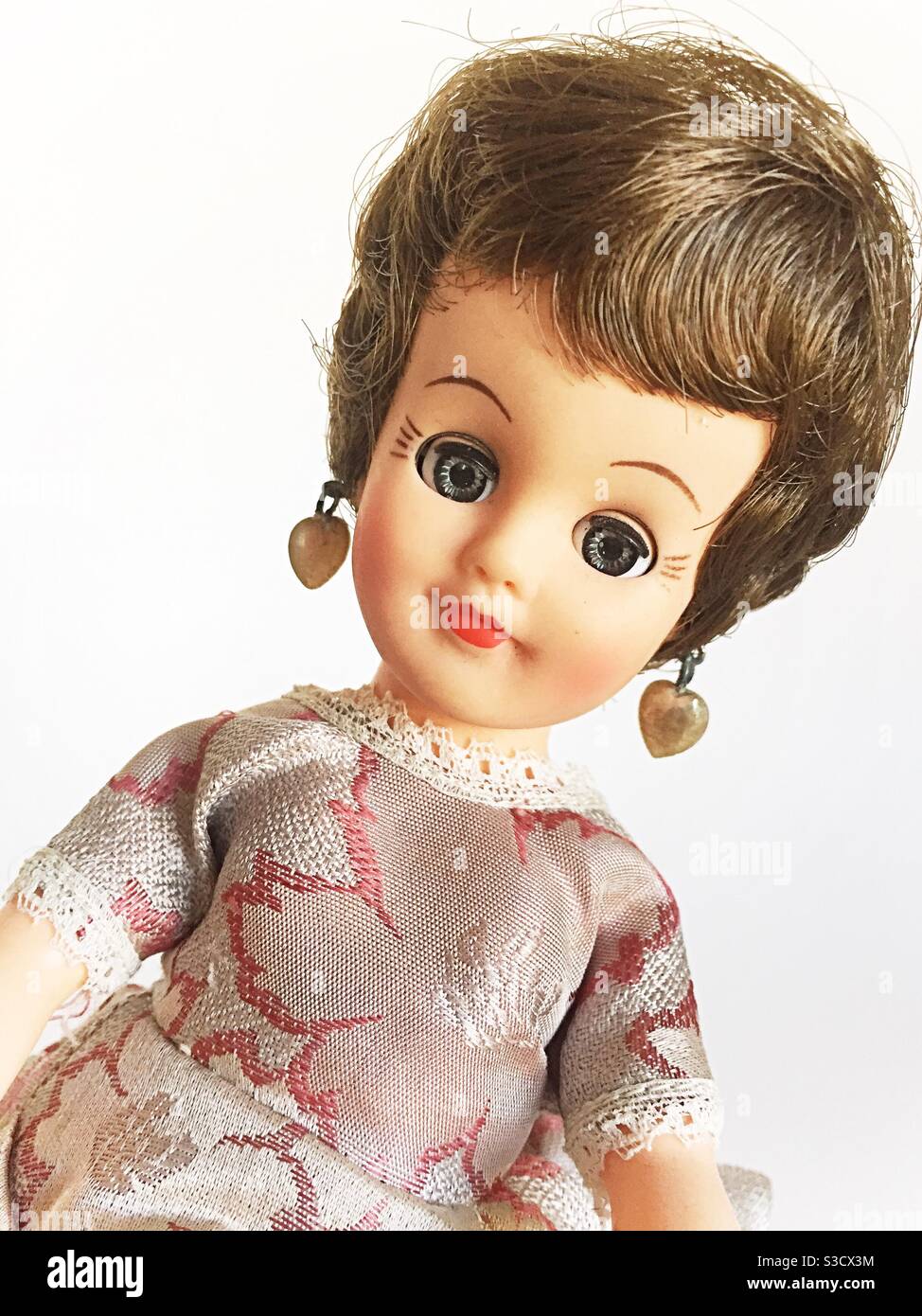 Antique Vogue Jill doll in a fancy evening dress Stock Photo