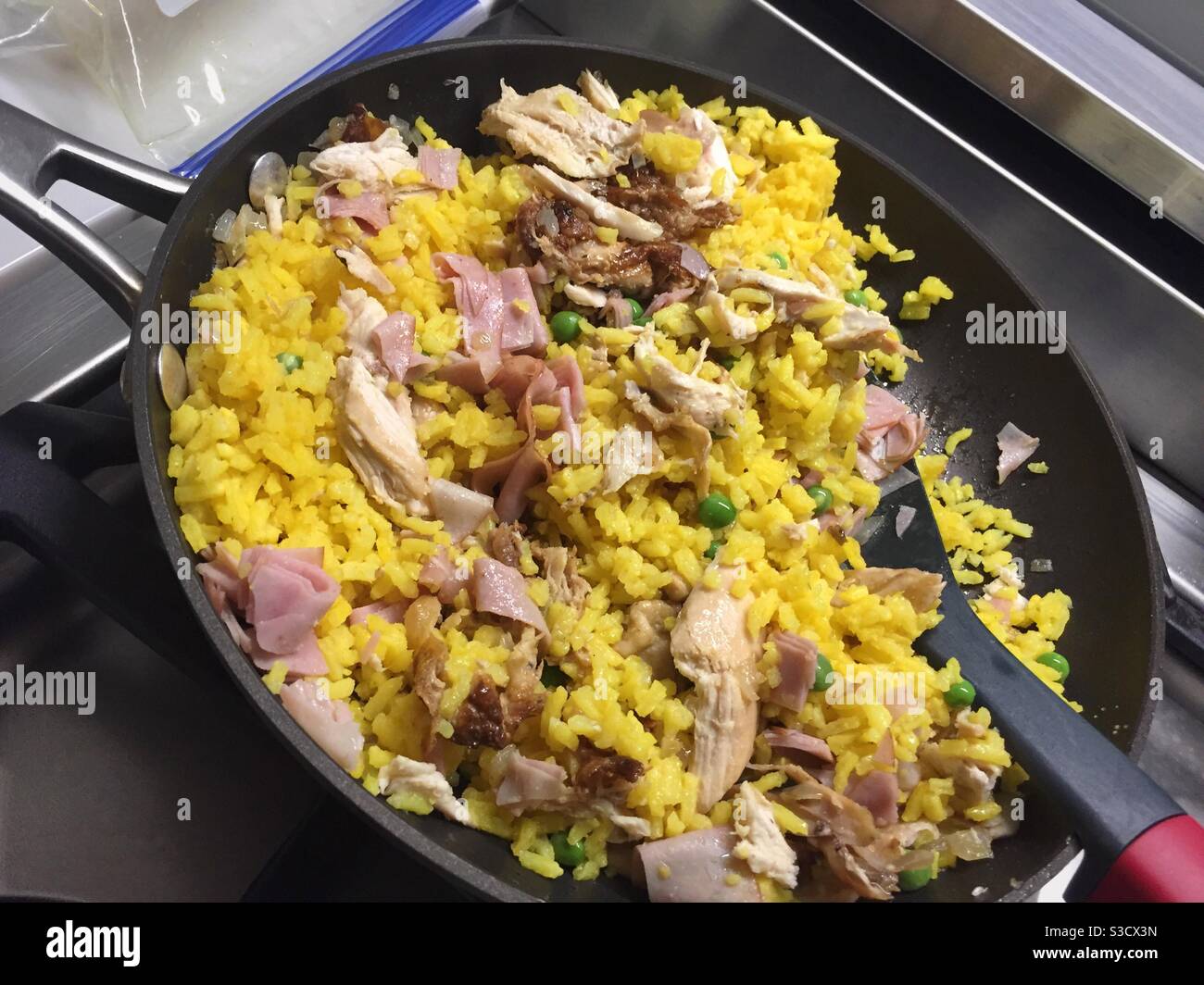 Chicken and yellow rice is a traditional Cuban one course meal dish. - Smartphone Captured Stock Image