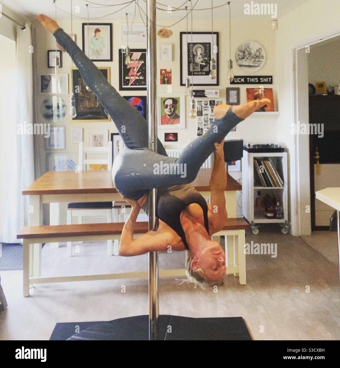 Pole dancing in my dining room - Smartphone Captured Stock Image