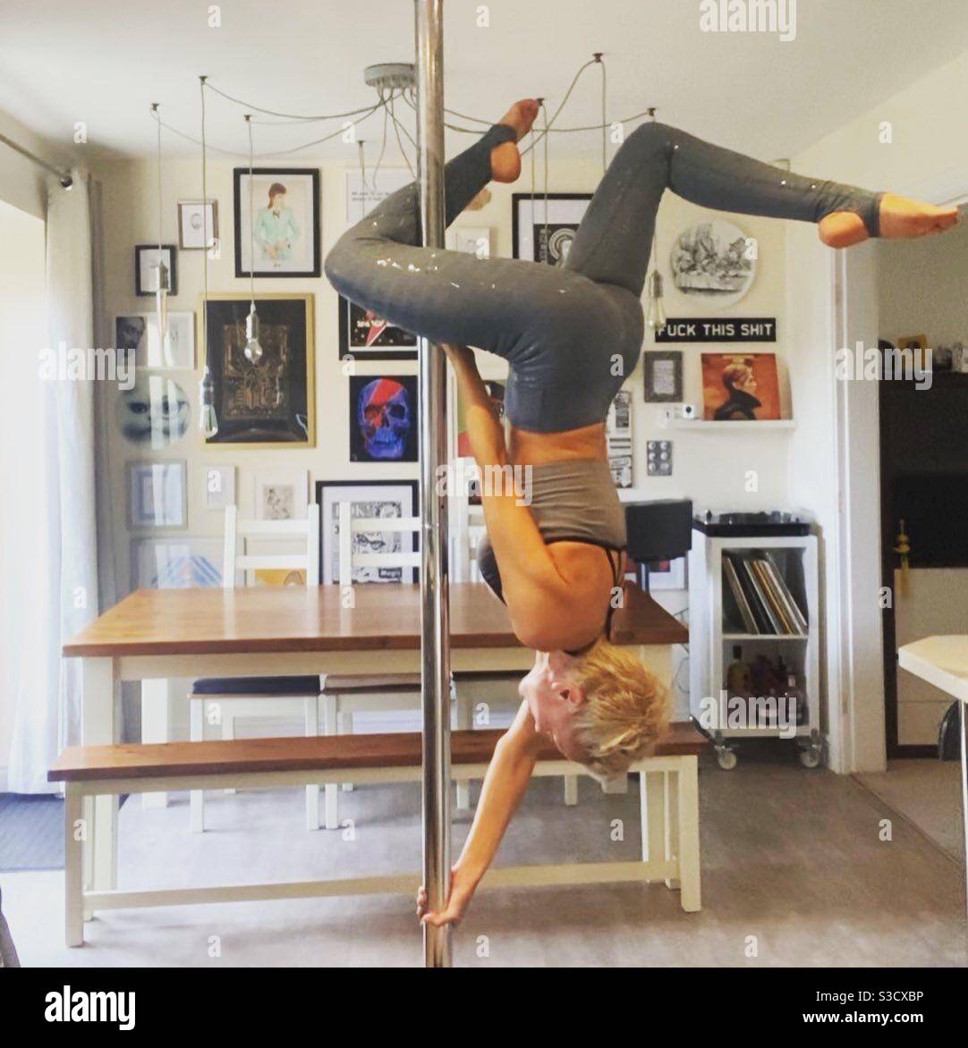 Pole dancing in my dining room - Smartphone Captured Stock Image