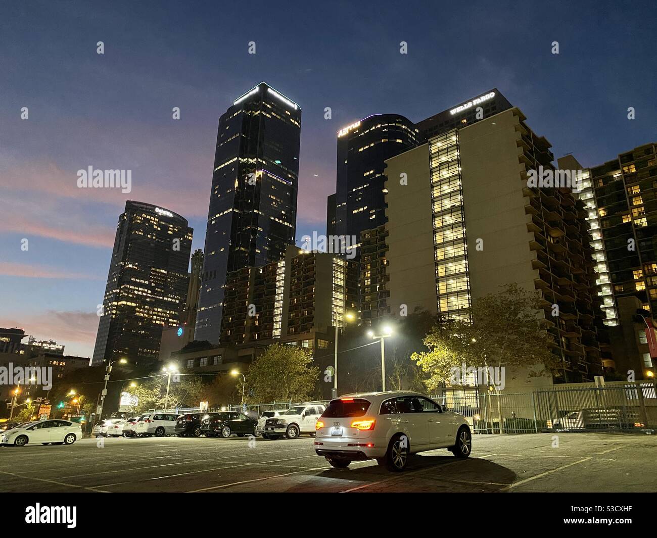 LOS ANGELES, CA, NOV 2020: night view of skyscrapers in Downtown Financial District, parking lot in foreground, just after dusk - Smartphone Captured Stock Image